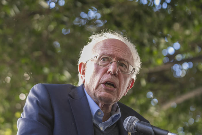 Sen. Bernie Sanders addresses Unite Here Local 11 workers protesting outside of Figueroa Hotel in downtown Los Angeles on Friday. Authorities charged a man with setting a fire at his Burlington, Vt., office that same day.