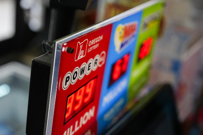 A sign for the Powerball jackpot is displayed at a 7-Eleven, Friday, April 5, 2024, in Portland, Ore.