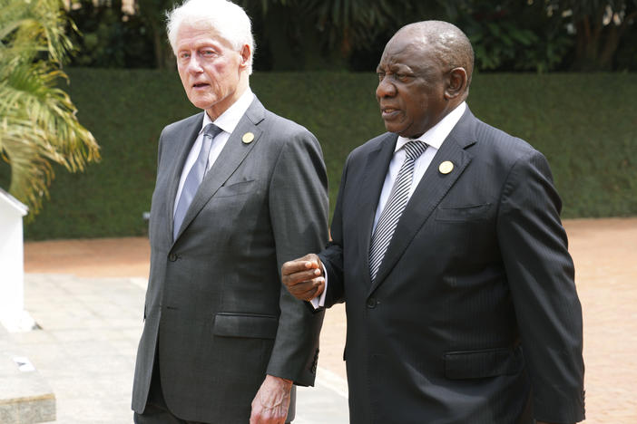 Former US President Bill Clinton, left, and South Africa's President Cyril Ramaphosa arrive to lay a wreath at a ceremony to mark the 30th anniversary of the Rwandan genocide, held at the Kigali Genocide Memorial, in Kigali, Rwanda, Sunday, April 7, 2024. Rwandans are commemorating 30 years since the genocide in which an estimated 800,000 people were killed by government-backed extremists.
