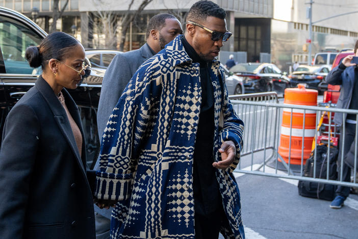 Actor Jonathan Majors arriving in court for his sentencing Monday morning in Manhattan, accompanied by his current partner, Meagan Good.