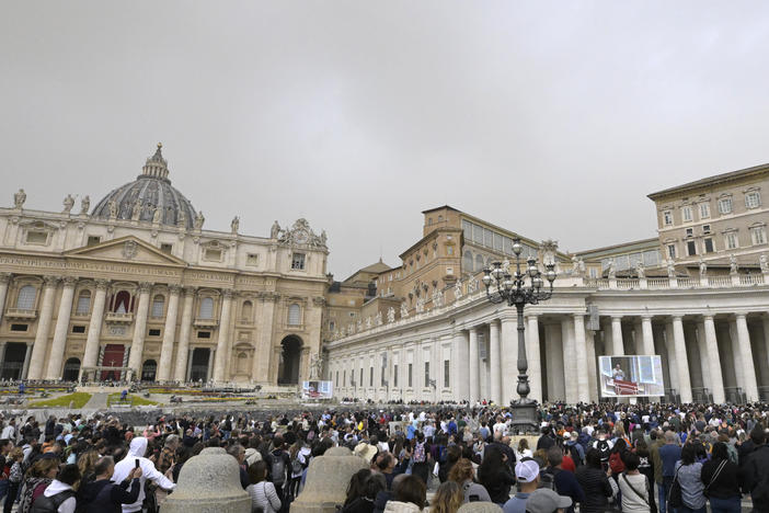 The crowd looks in direction of the window of the apostolic palace overlooking St. Peter's square during Pope Francis' prayer on April 1 in The Vatican.
