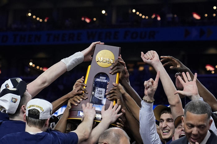 UConn players celebrate after the NCAA college Final Four championship basketball game against Purdue, Monday, April 8, 2024, in Glendale, Ariz.
