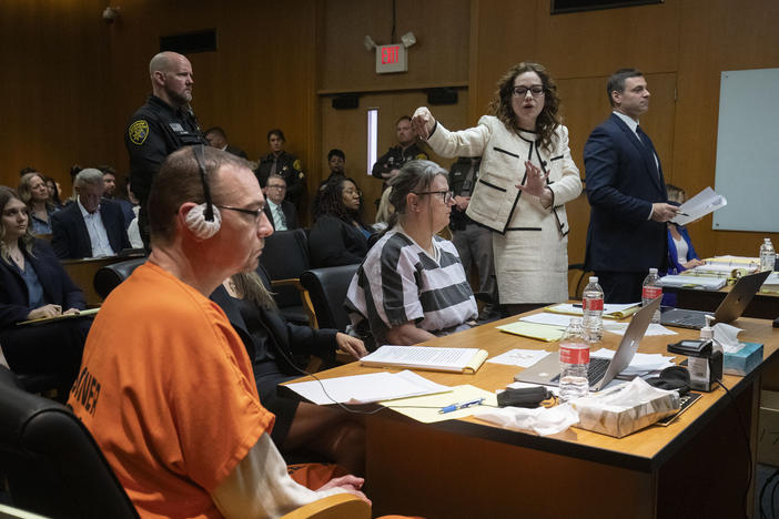 (From left) James Crumbley, his attorney Mariell Lehman, Jennifer Crumbley and her attorney Shannon Smith sit in court in Pontiac, Mich., for Tuesday's sentencing on four counts of involuntary manslaughter for the deaths of four Oxford High School students who were shot and killed by the Crumbleys' son.