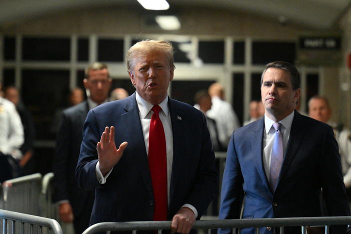 Former President Donald Trump speaks to the press at Manhattan criminal court after a hearing on Feb. 15.