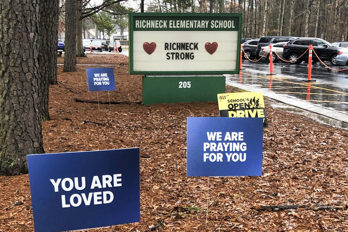 Signs stand outside Richneck Elementary School in Newport News, Va., Jan. 25, 2023.