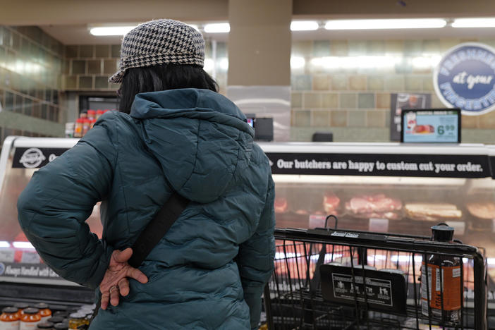 A customer shops at a grocery store in Chicago on Feb. 13, 2024. Annual inflation has eased significantly since two years ago but it has remained stubbornly above 3% this year.
