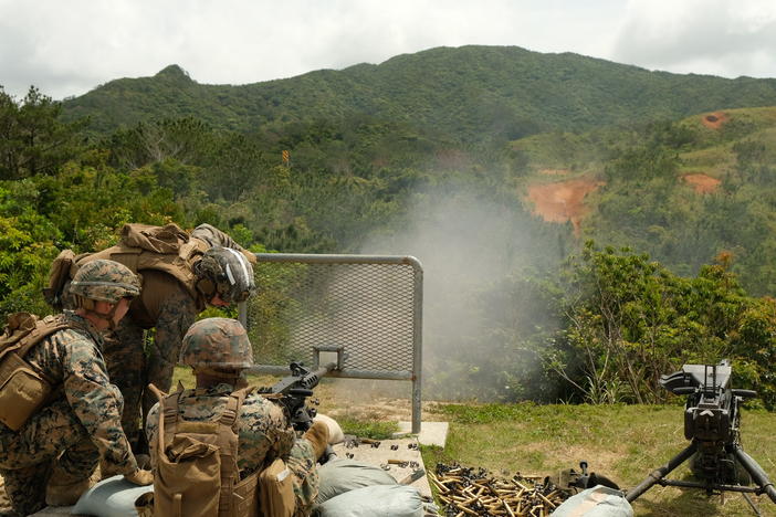 Marines of the 12th Marine Littoral Regiment practice with .50-caliber machine guns on a firing range on Okinawa.