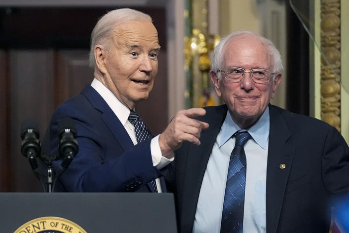 President Biden stands with Sen. Bernie Sanders, I-Vt., on April 3, 2024. Four years ago, Sanders endorsed Biden, and the former rivals worked together to craft policy proposals that bridged Democratic divides.