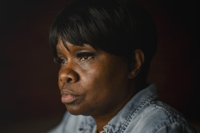 Tanya Warden, 55, sits for a portrait at her workplace in Philadelphia on Tuesday, March 26 2024. Warden's son, Tyron Alexander, was shot multiple times and died in October 2020.
