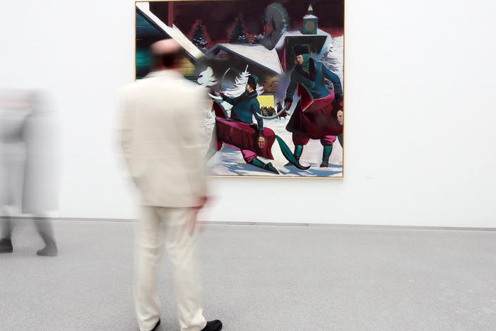 Preview visitors attend the Neo Rauch exhibition "Begleiter" at Pinakothek der Moderne art museum in Munich, Germany, on April 19, 2010.