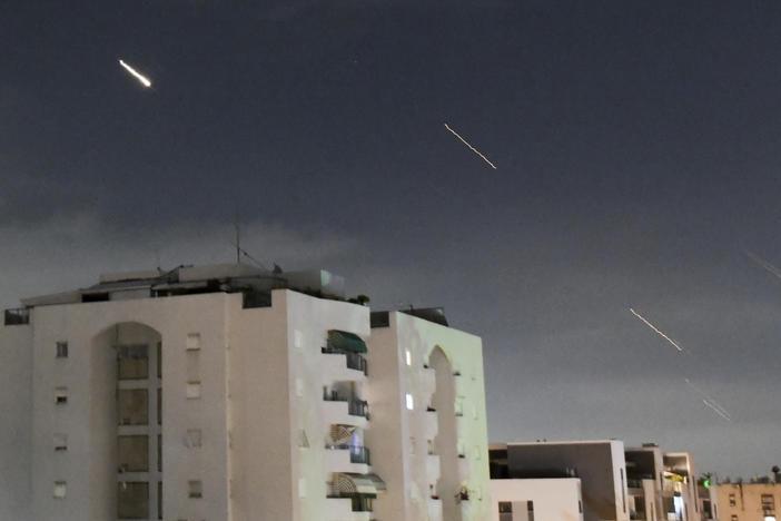 Israeli Iron Dome air defense systems launch to intercept missiles fired from Iran, in central Israel on Sunday.
