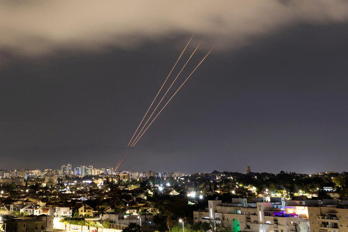 An anti-missile system operates after Iran launched drones and missiles toward Israel, as seen from Ashkelon, Israel, April 14.