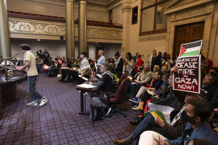 Audience members listen to public comment at a special session of the Oakland City Council about a resolution calling for an immediate cease-fire in Gaza on Nov. 27, 2023, in Oakland, Calif.