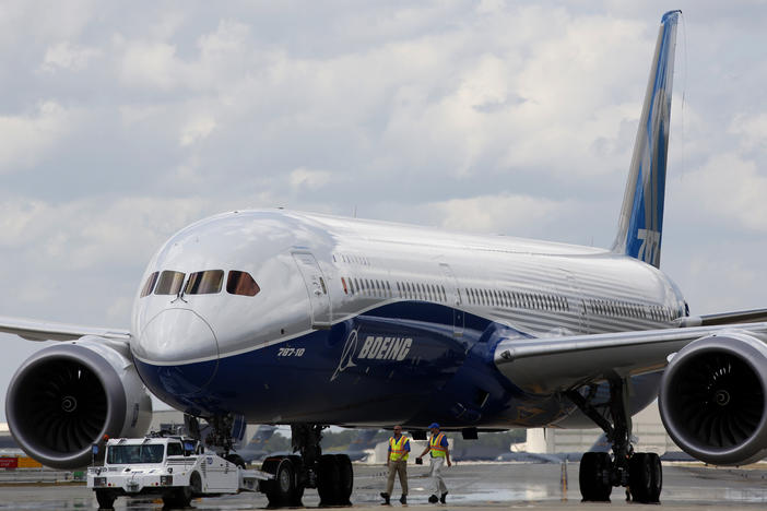 Boeing employees walk the new Boeing 787-10 Dreamliner down towards the delivery ramp area at the company's facility after conducting its first test flight at Charleston International Airport in 2017. A Senate subcommittee has opened an investigation into the safety of Boeing jetliners, intensifying safety concerns about the company's aircraft.
