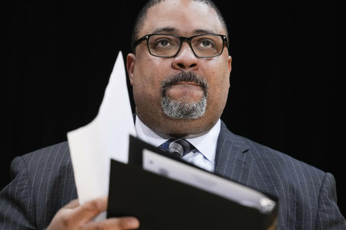 Manhattan District Attorney Alvin Bragg listens at news conference in New York, Feb. 7, 2023. Donald Trump has made history as the first former president to face criminal charges.