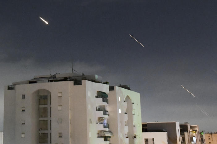 Israeli Iron Dome air defense system launches to intercept missiles fired from Iran, in central Israel, Sunday, April 14, 2024.