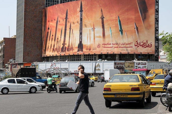A billboard in central Tehran, Iran, depicts named Iranian ballistic missiles in service, with text in Arabic reading "the honest [person's] promise" and text in Persian reading "Israel is weaker than a spider's web," on April 15. Iran attacked Israel over the weekend with missiles, which it said was a response to a deadly strike on its consulate building in Damascus, Syria.