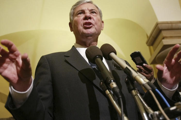 Former Senate Intelligence Committee Chairman Sen. Bob Graham, D-Fla., gestures as he answers questions on Capitol Hill, June 18, 2002, in Washington.