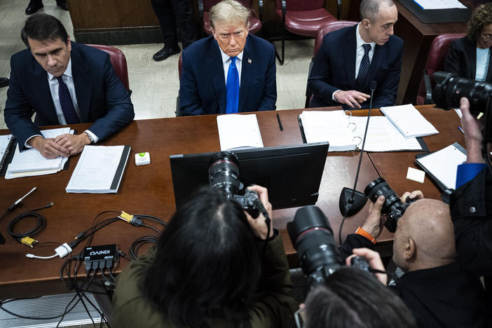 Former President Donald Trump, flanked by attorneys Todd Blanche (left) and Emil Bove (right), arrives for his criminal trial as jury selection continues at Manhattan court on Thursday.