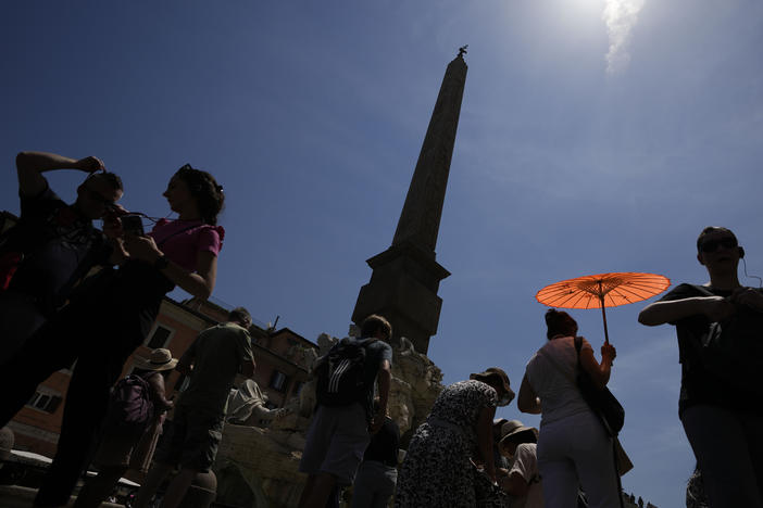 People in the streets of Rom in June 2022. Heat-related deaths in Europe have increased by about 30% in the last 20 years, according to a new report.