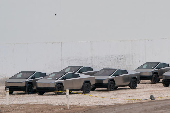 Newly manufactured Tesla Cybertrucks are parked outside the company's Giga Texas factory on December 13, 2023, in Austin, Texas.