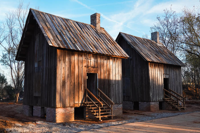 Structures in the Freedom Monument Sclupture park give a sense of the homes enslaved individuals lived in.
