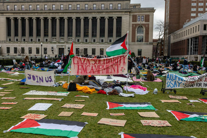 Students occupy the campus Columbia University on Friday, calling for the school to divest from companies with ties to Israel.