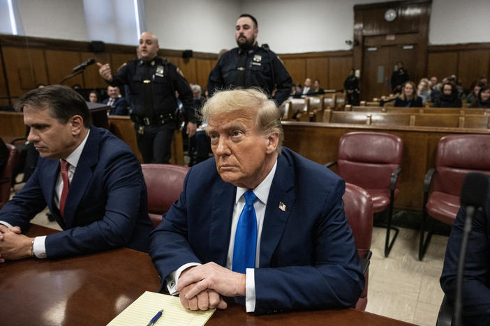 Former President Donald Trump looks on at Manhattan criminal court Monday, during his trial for allegedly covering up hush money payments linked to extramarital affairs.