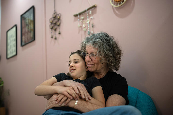 Aviva Siegel, who was held hostage in Gaza for 51 days, and whose husband Keith remains in Hamas captivity, spends time with her eight-year-old granddaughter Yali Tiv at her daughter's home on Kibbutz Gazit on March 26. Aviva has been staying with her daughter in northern Israel since being released in November.