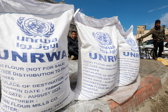 Displaced Palestinians wait to receive UNRWA aid in Rafah, in the southern Gaza Strip, March 7.