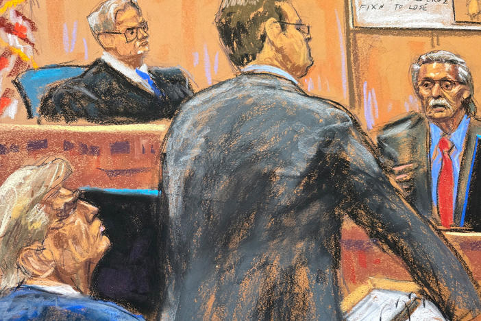 Former President Donald Trump watches as prosecutor Joshua Steinglass questions David Pecker before Judge Juan Merchan during Trump's criminal trial in Manhattan on Tuesday.