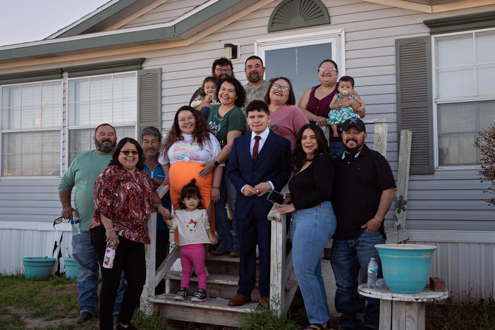 Caitlynn Almance (wearing orange) poses for a portrait with family members at her parents' home in Odessa, Texas. "The bond my siblings have with each other — it's just the most beautiful bond ever," says Caitlynn, who was six months pregnant in this photo taken in early March.