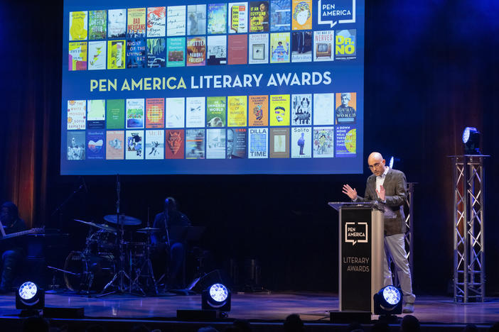 Playwright Ayad Akhtar on stage at the 2023 PEN America Literary Awards in his role as then-president of the organization.