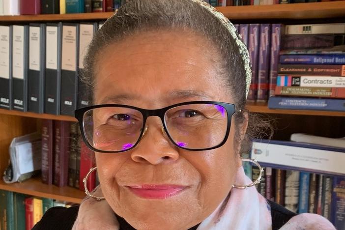 Pamela Hill-Veal says that while she and her family were flying first class on Feb. 10 from Chicago to Phoenix, an American Airlines flight attendant stopped her as she returned to her seat and accused her of slamming the restroom door.