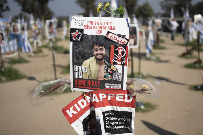 A poster depicting Israeli-American hostage Hersh Goldberg-Polin is displayed in Re'im, southern Israel at the Gaza border in February 2024 at a memorial site for the Nova music festival site where he was kidnapped to Gaza by Hamas on Oct. 7, 2023.