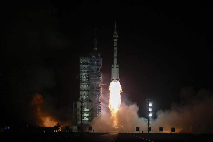 A Long March rocket carrying a crew of Chinese astronauts in a Shenzhou-18 spaceship lifts off at the Jiuquan Satellite Launch Center in northwestern China on Thursday.