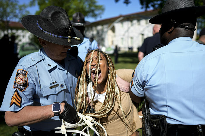 Georgia State Patrol officers detain a demonstrator on the campus of Emory University during a pro-Palestinian demonstration on Thursday, April 25 in Atlanta.