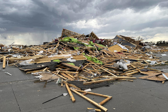 Debris is seen from a destroyed home northwest of Omaha, Neb., after a storm tore through the area on Friday.