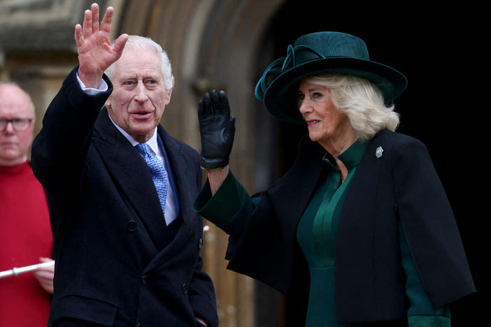Britain's King Charles III (center), next to Queen Camilla, waves as they arrive at St. George's Chapel, Windsor Castle, on March 31.