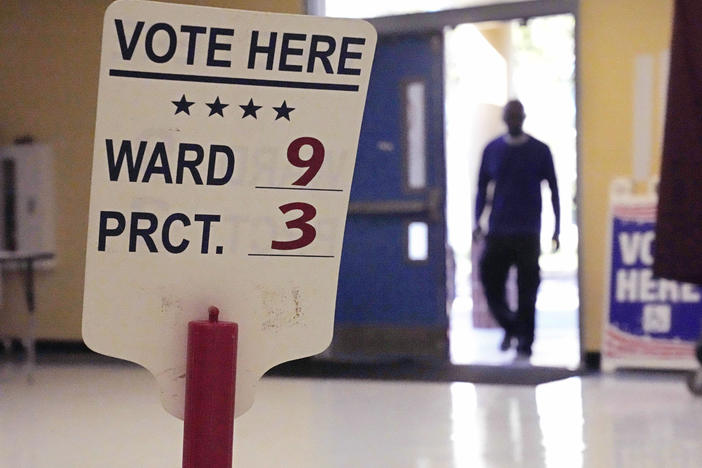 A voter enters the Dr. Martin Luther King Jr. Charter Elementary School in New Orleans to cast a ballot in the 2022 elections.