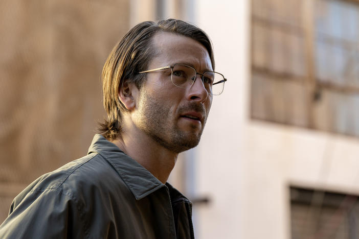 Glen Powell stars in the new movie <em>Hit Man</em>.