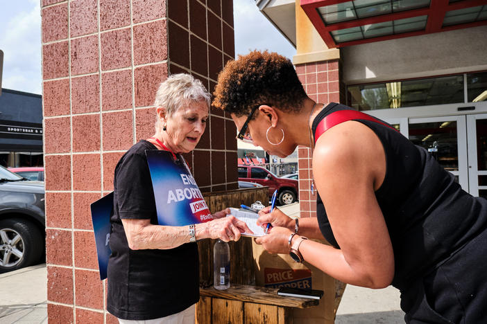 Alice Kitchen, 81, canvasses for signatures at a Costco parking lot in Kansas City, Mo. She and other abortion rights advocates are trying to collect 172,000 valid signatures by May 5 to ensure a statewide ballot measure in November on whether to enshrine abortion rights in Missouri's constitution.