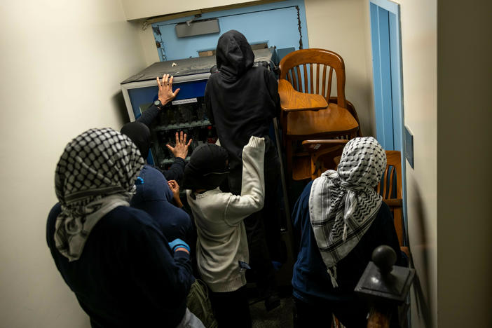Demonstrators supporting Palestinians in Gaza barricade themselves inside Hamilton Hall, where the office of the dean is located, on April 30 in New York City.