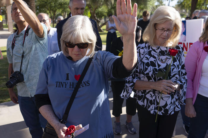 Anti-abortion rights advocates demonstrate prior to an Arizona House of Representatives session at the Arizona state Capitol on April 17 in Phoenix.