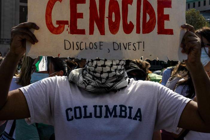 A demonstrator protests outside the encampment established in support of Palestinians in Gaza at Columbia University on April 29, 2024. Columbia protesters are demanding their university sell off investments in a number of companies with business ties to Israel.