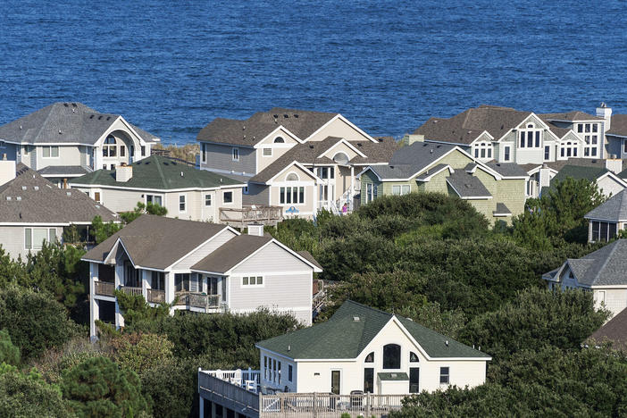 A cabinet maker in North Carolina is seeing interest rates slow down home development. His clients in the Outer Banks though, pictured here, are moving ahead as normal.