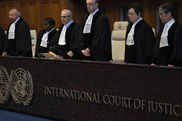 Presiding judge Nawaf Salam (fourth from left) arrives to read a decision at the International Court of Justice in The Hague, Netherlands, Tuesday.