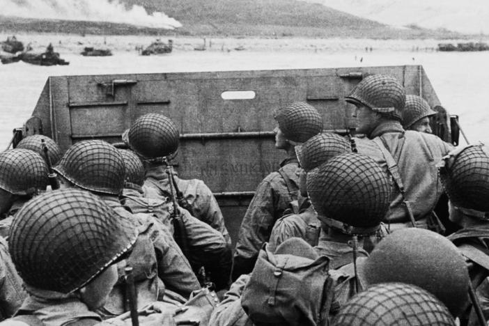 American soldiers huddle inside a landing craft approaching Utah Beach during the Allied invasion of Normandy, France, on D-Day.