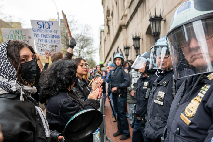 Students and pro-Palestinian activists face police as they gather outside of Columbia University to protest the university's stance on Israel's war in Gaza.