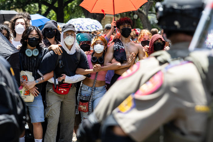 Law enforcement form a circle around the encampment of pro-Palestinian protestors on April 29, at the University of Texas at Austin.